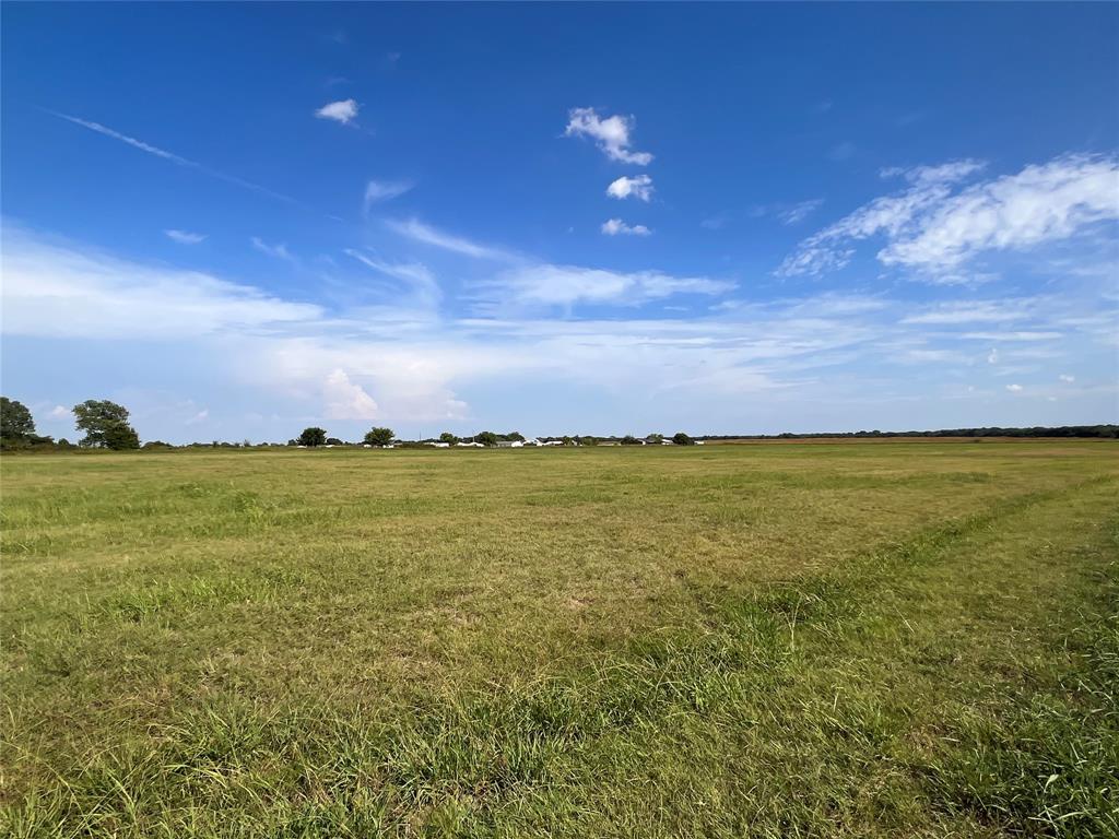 264 Sidewinder Loop Red Oak, TX 75154 - Photo 7 of 13 a view of a lake and a yard