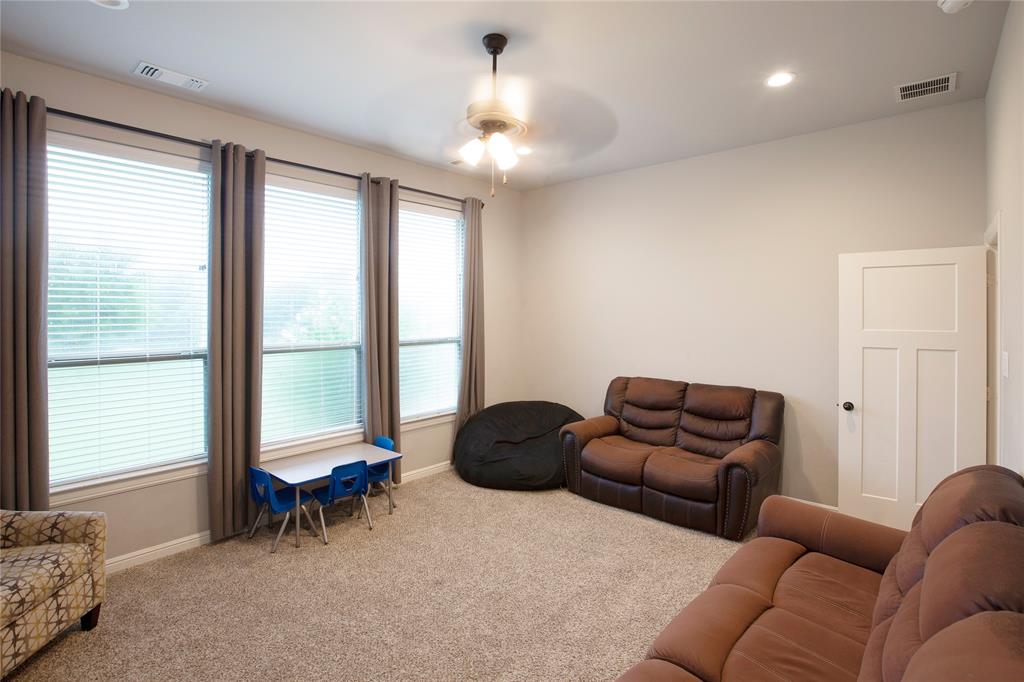 7230 Woodstream Road Midlothian, TX 76065 - Photo 14 of 26 a living room with furniture and a window