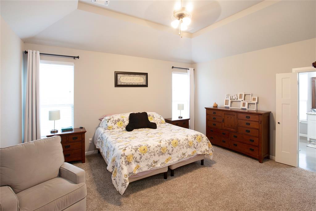 7230 Woodstream Road Midlothian, TX 76065 - Photo 16 of 26 a bedroom with a bed and a couch