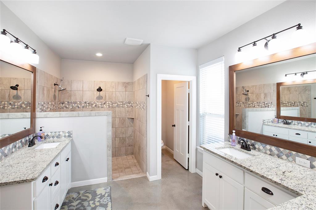 7230 Woodstream Road Midlothian, TX 76065 - Photo 17 of 26 a bathroom with a granite countertop sink mirror and double