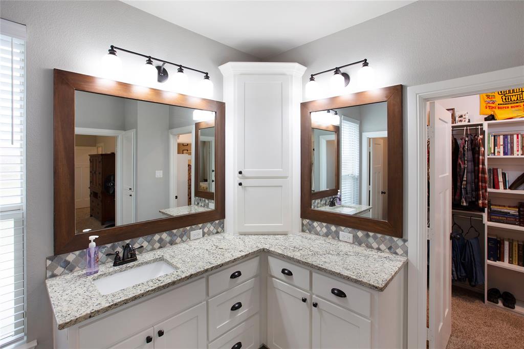 7230 Woodstream Road Midlothian, TX 76065 - Photo 19 of 26 a bathroom with a granite countertop double vanity sink and a mirror