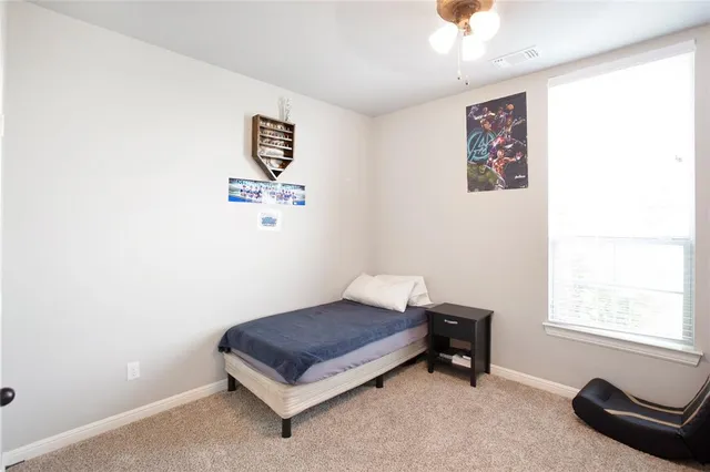 a room with a bed and a window