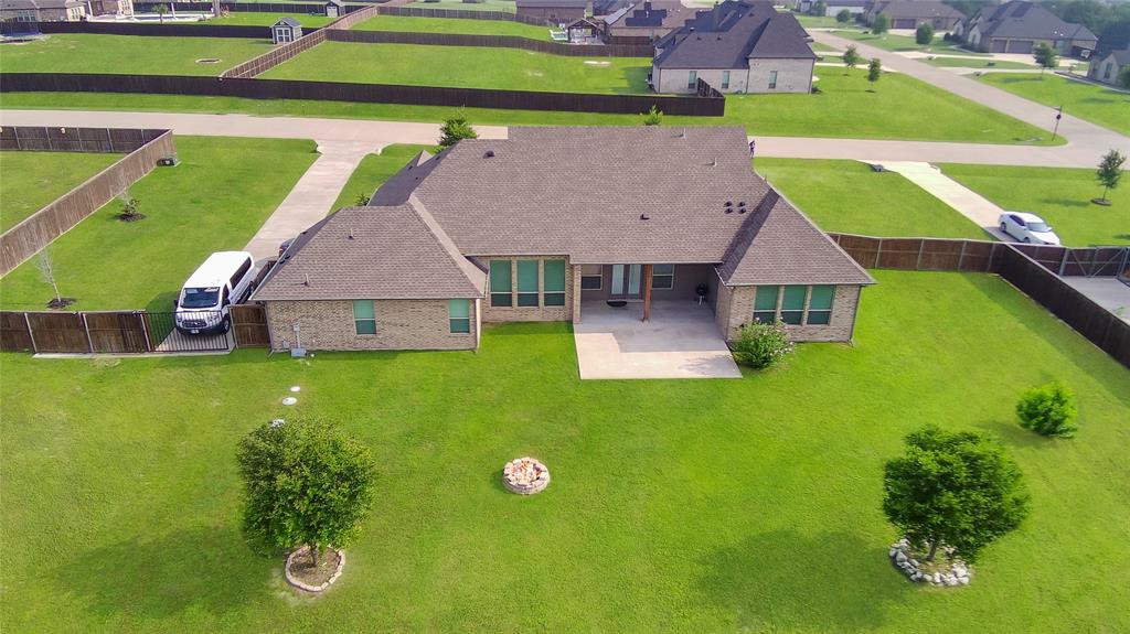 7230 Woodstream Road Midlothian, TX 76065 - Photo 4 of 26 a aerial view of a house with a garden and plants