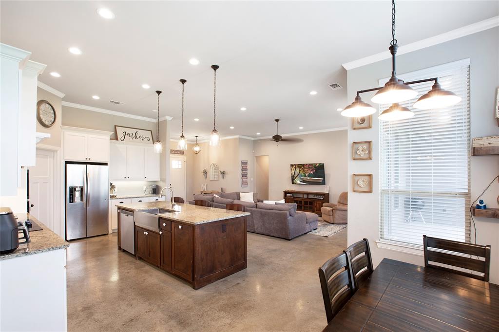 7230 Woodstream Road Midlothian, TX 76065 - Photo 7 of 26 a open kitchen with stainless steel appliances granite countertop a stove and a refrigerator