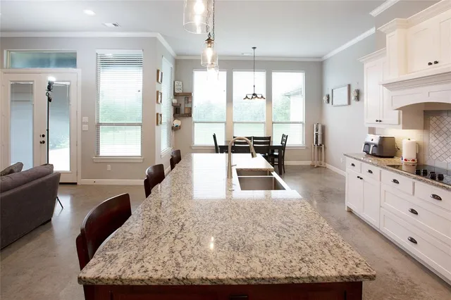 a living room with granite countertop furniture and a large window