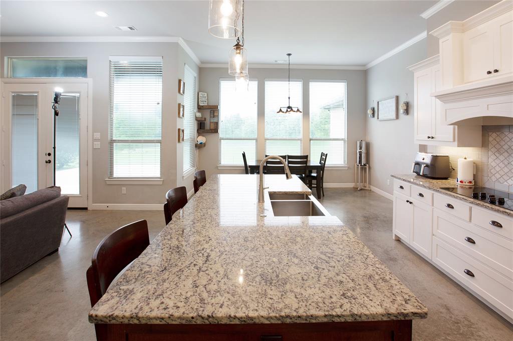 7230 Woodstream Road Midlothian, TX 76065 - Photo 10 of 26 a living room with granite countertop furniture and a large window