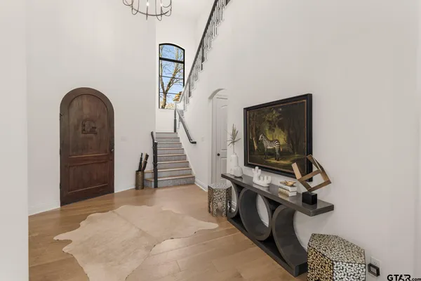 a large kitchen with lots of counter space a sink appliances and living room view