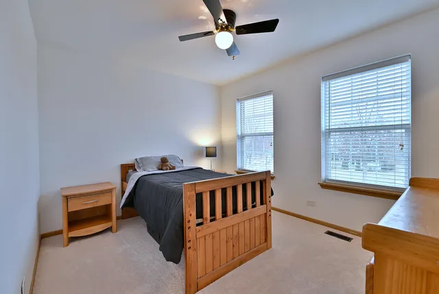a bedroom with furniture and a window