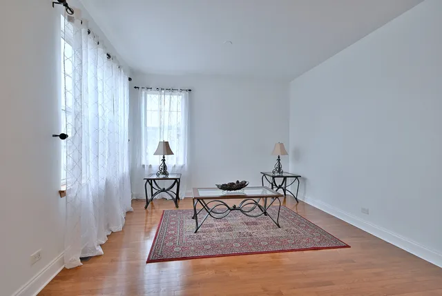 a view of a livingroom with furniture and wooden floor
