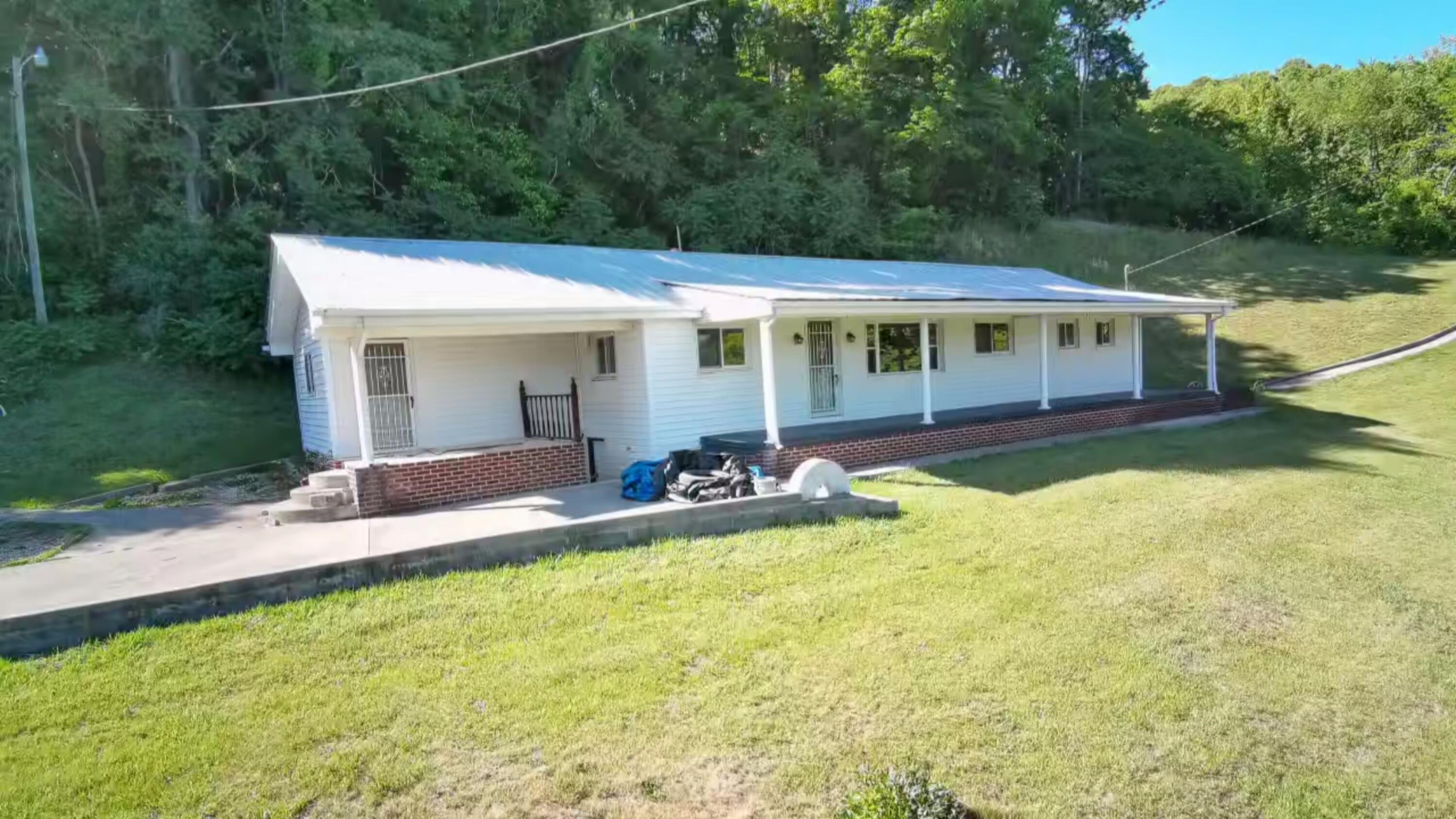 415 Stock Pen Mountain Road Narrows, VA 24124 - Photo 1 of 16 a view of a house with swimming pool and porch
