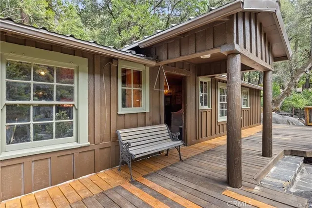 a view of a chairs and table in a balcony