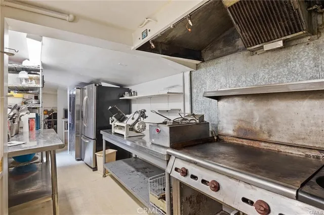 a view of a house with a mountain and trees