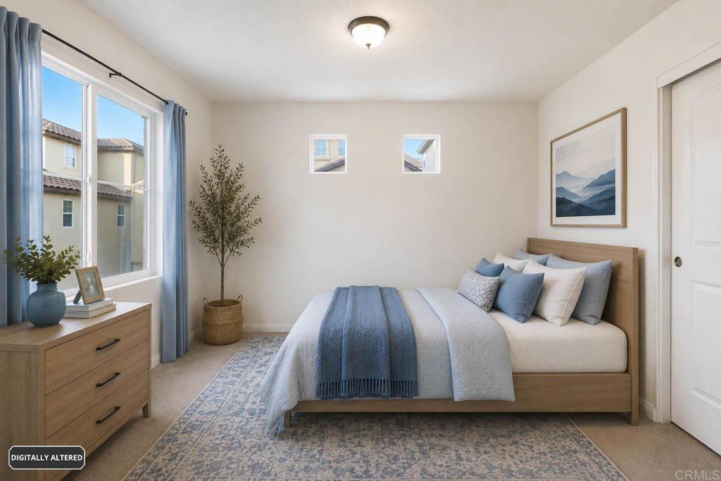 1508 Carpinteria Street Chula Vista, CA 91913 - Photo 26 of 39 a spacious bedroom with a bed and a potted plant