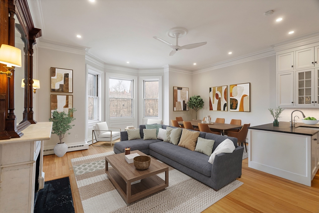 64 Commonwealth Avenue, Unit 5 Boston, MA 02116 - Photo 2 of 24 a living room with furniture and a large window