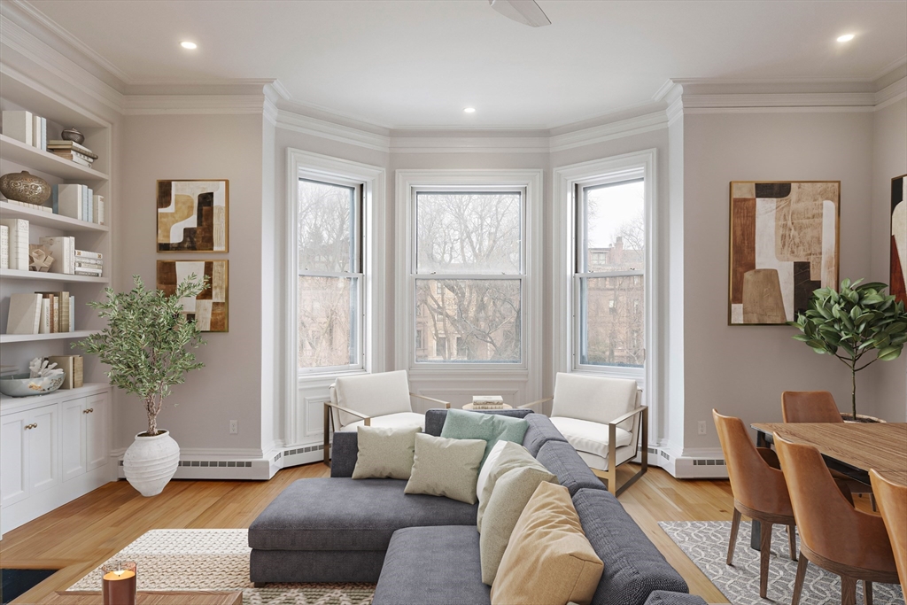 64 Commonwealth Avenue, Unit 5 Boston, MA 02116 - Photo 3 of 24 a living room with furniture and a potted plant
