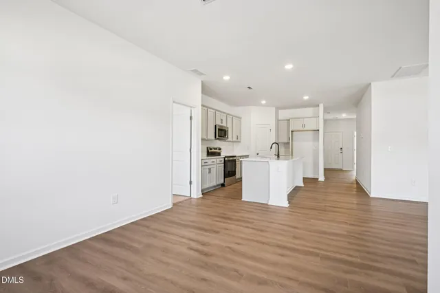 a view of a kitchen with wooden floor