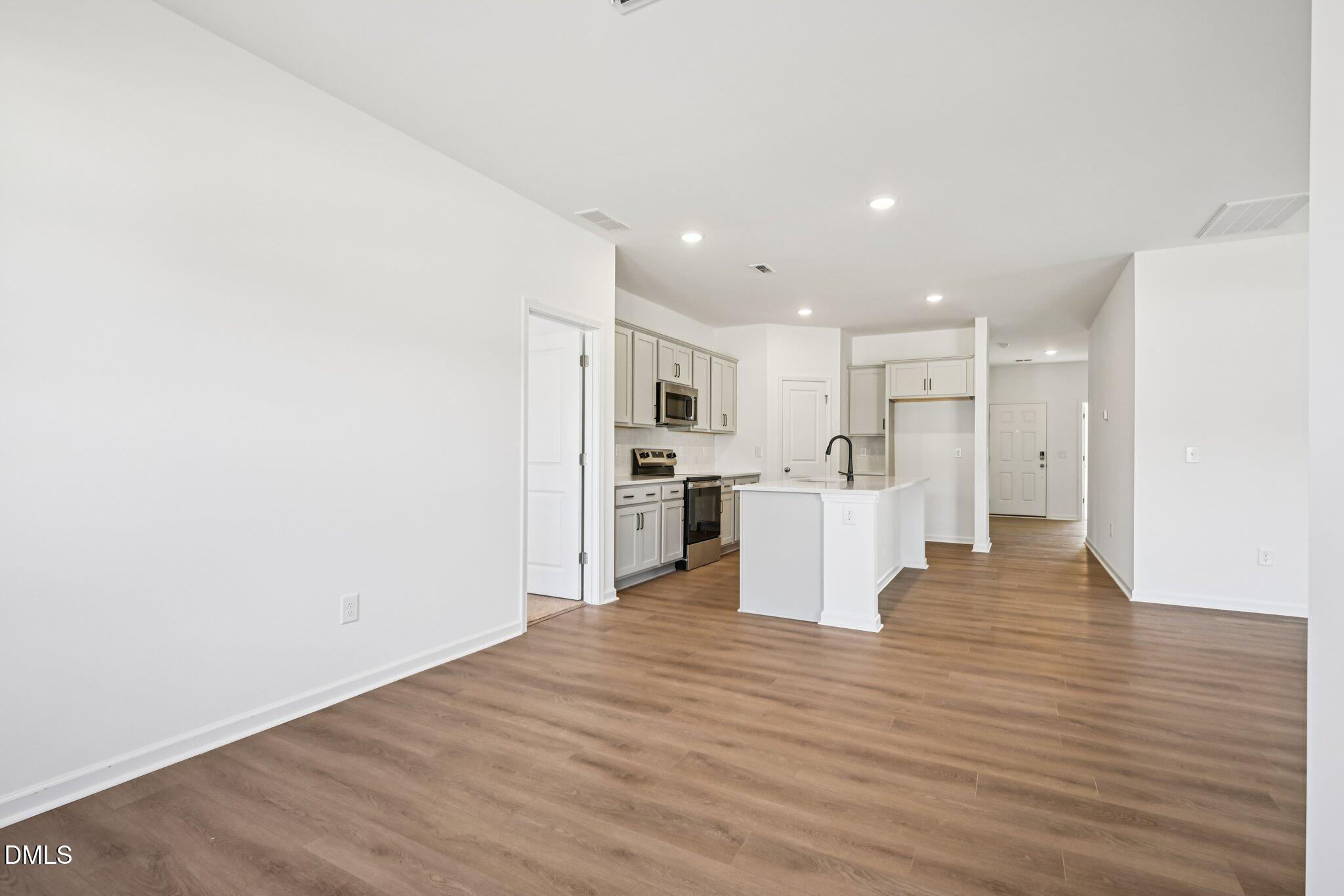 11766 Salers Loop Middlesex, NC 27557 - Photo 11 of 55 a view of a kitchen with wooden floor