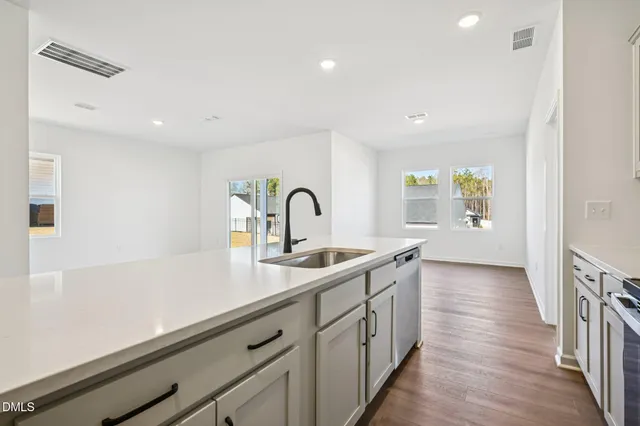 a kitchen with a sink and cabinets
