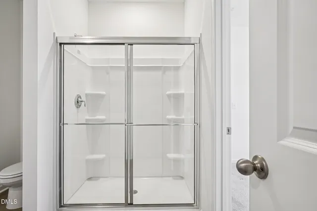 a view of house with backyard and trees