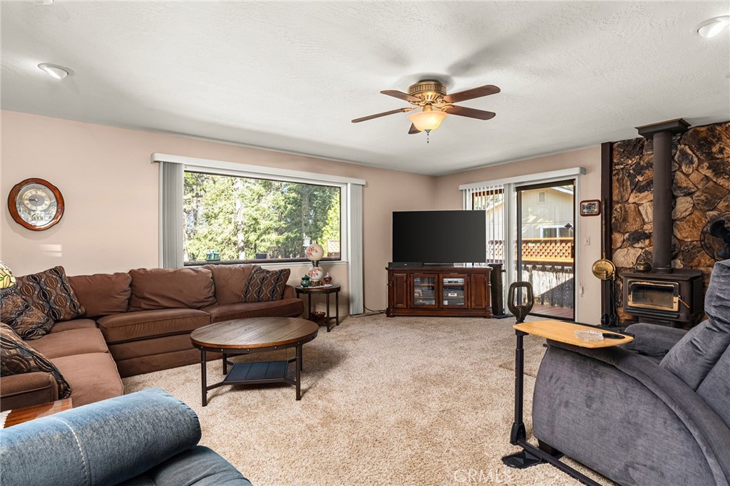 14219 Wycliff Way Magalia, CA 95954 - Photo 11 of 67 a living room with furniture and a flat screen tv