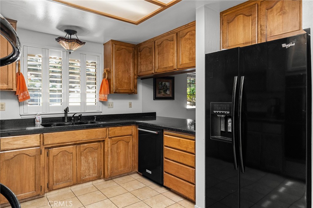 14219 Wycliff Way Magalia, CA 95954 - Photo 17 of 67 a kitchen with stainless steel appliances granite countertop a refrigerator and a sink
