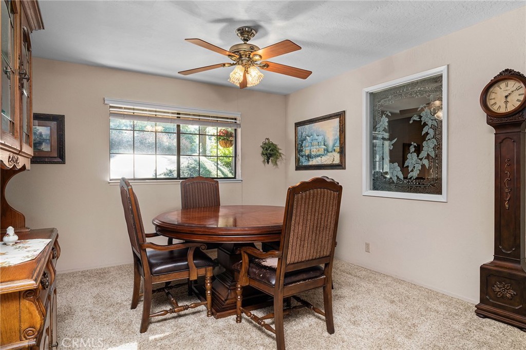 14219 Wycliff Way Magalia, CA 95954 - Photo 20 of 67 a view of a dining room with furniture and a chandelier