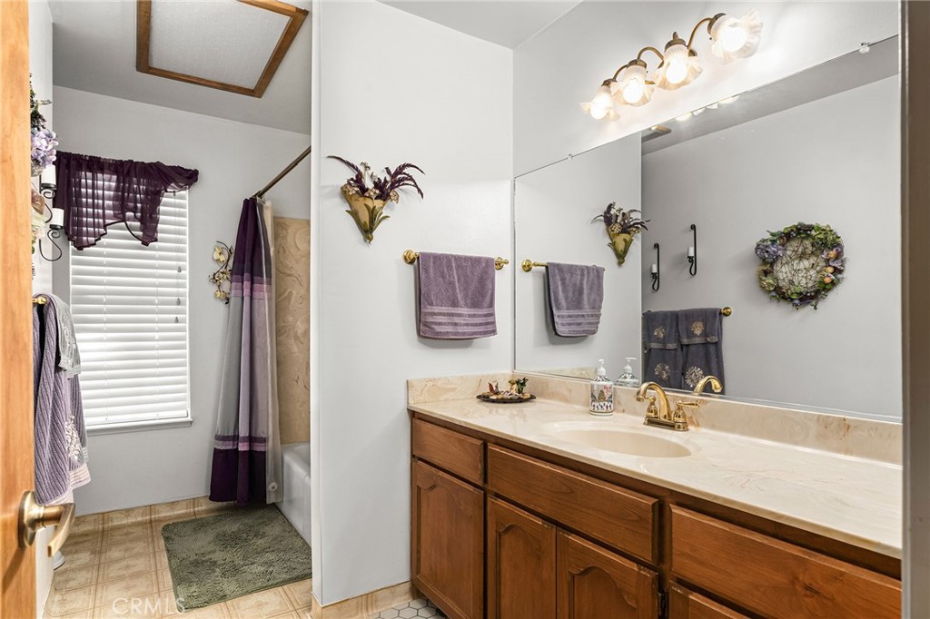 14219 Wycliff Way Magalia, CA 95954 - Photo 22 of 67 a bathroom with a sink double vanity and a mirror
