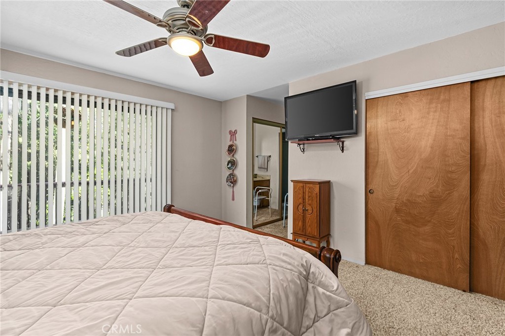 14219 Wycliff Way Magalia, CA 95954 - Photo 25 of 67 a bedroom with a bed and a flat screen tv