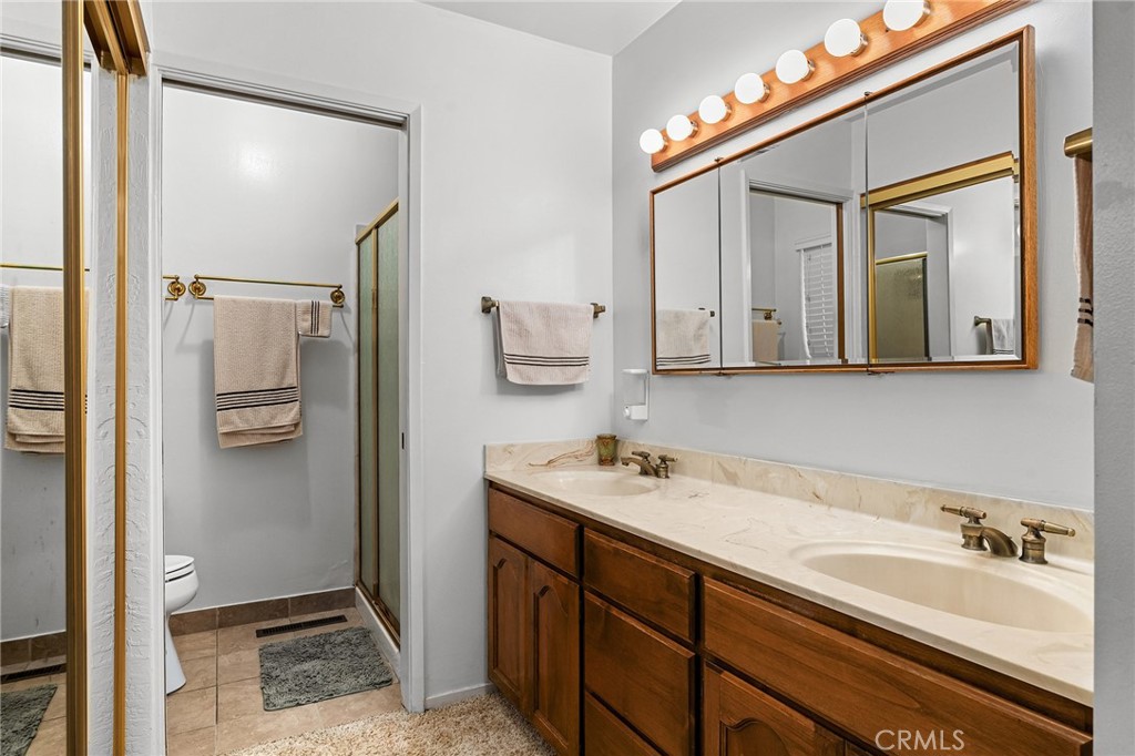 14219 Wycliff Way Magalia, CA 95954 - Photo 27 of 67 a bathroom with a sink and a mirror