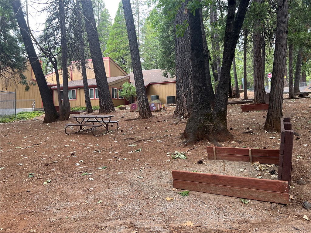 14219 Wycliff Way Magalia, CA 95954 - Photo 56 of 67 a backyard of a house with table and chairs