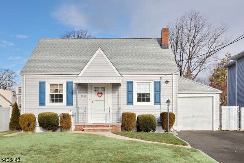 22-06 Arcadia Road Fair Lawn, NJ 07410 - Photo 1 of 33 a front view of a house with a yard