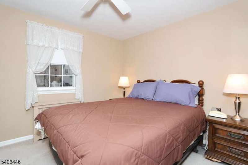 22-06 Arcadia Road Fair Lawn, NJ 07410 - Photo 10 of 33 a large bed sitting in a bedroom next to a window