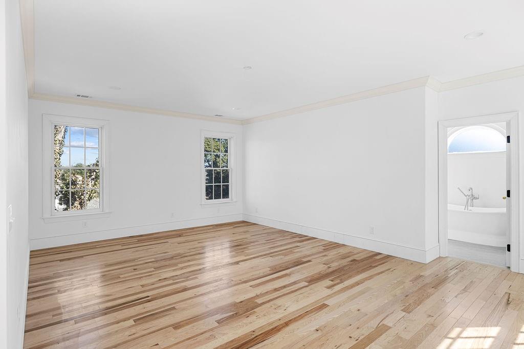 312 East 3rd Street Rome, GA 30161 - Photo 27 of 42 a view of empty room with wooden floor and fan