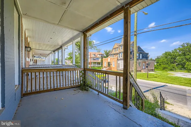 a view of a porch with wooden floor