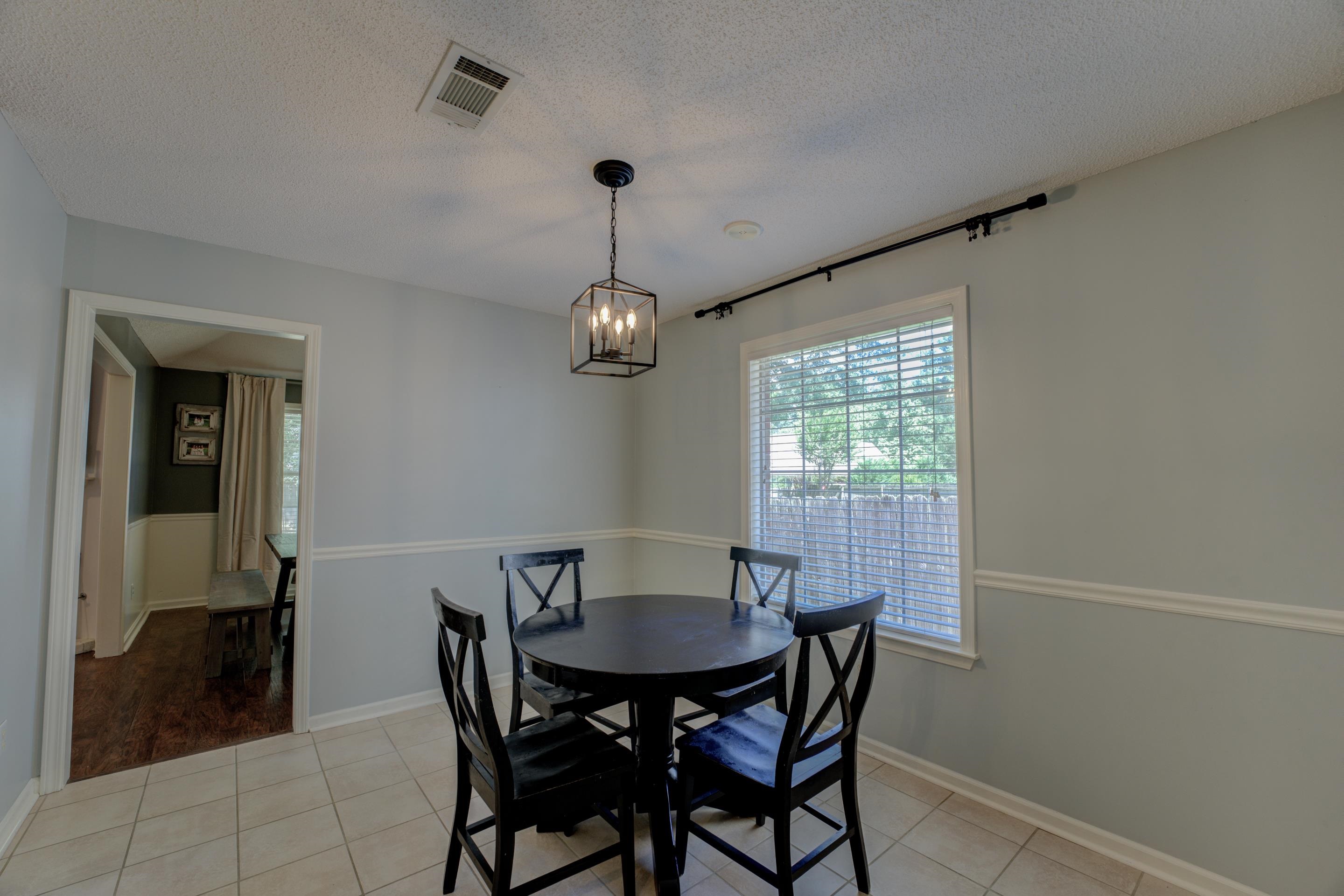 1515 Wolf Pack Drive Collierville, TN 38017 - Photo 14 of 28 a view of a dining room with furniture window and outside view