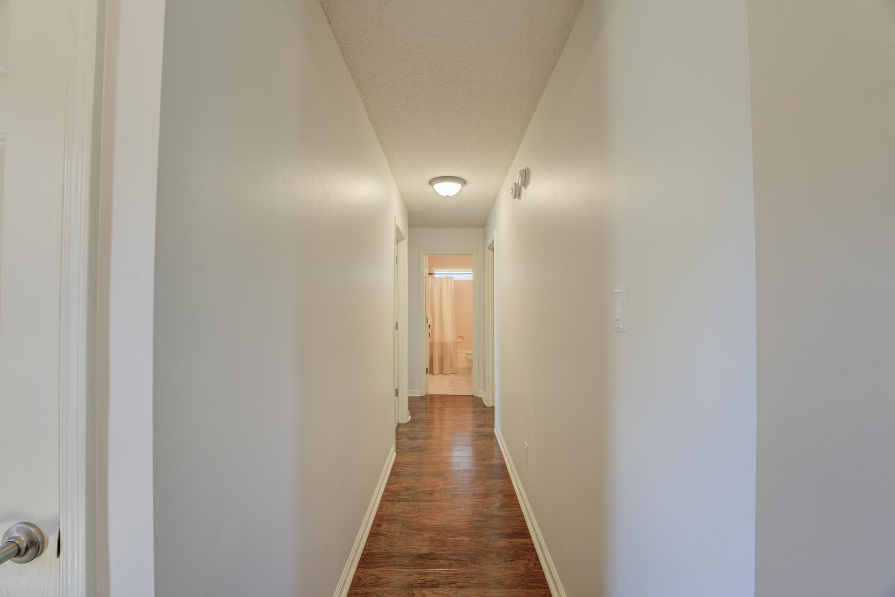 1515 Wolf Pack Drive Collierville, TN 38017 - Photo 16 of 28 a view of a hallway with wooden floor