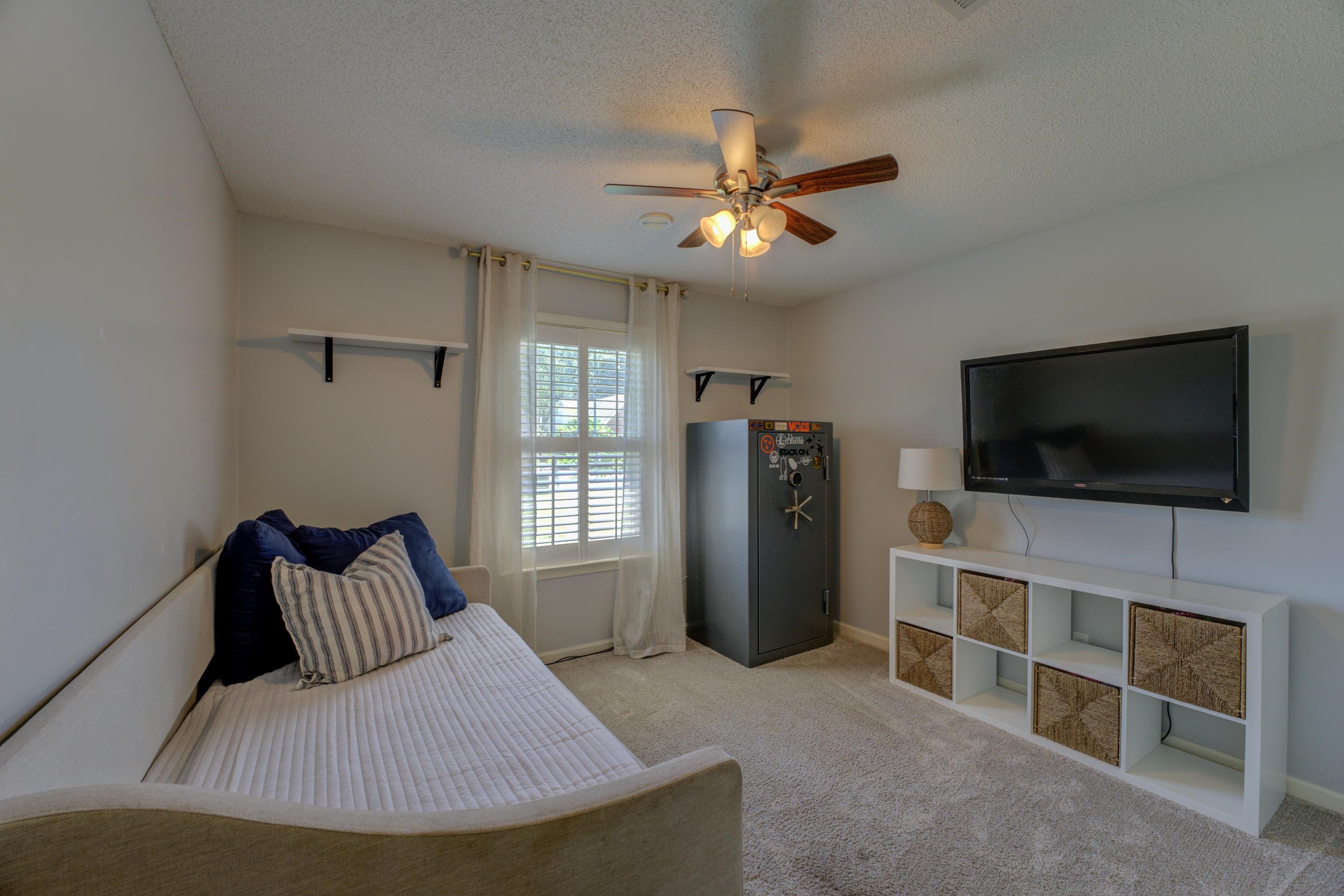 1515 Wolf Pack Drive Collierville, TN 38017 - Photo 20 of 28 a bedroom with furniture and flat screen tv