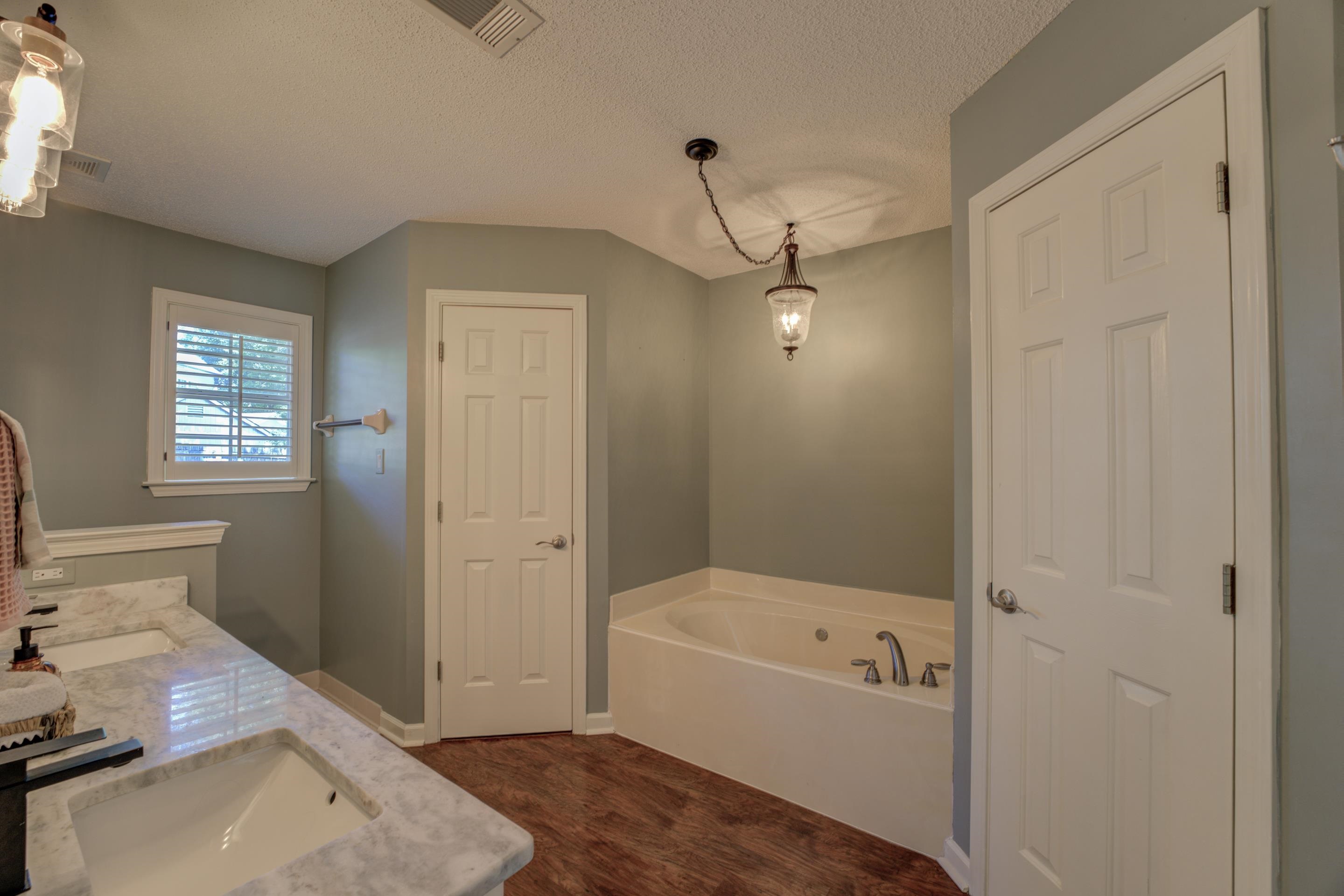 1515 Wolf Pack Drive Collierville, TN 38017 - Photo 23 of 28 a bathroom with a tub shower and sink