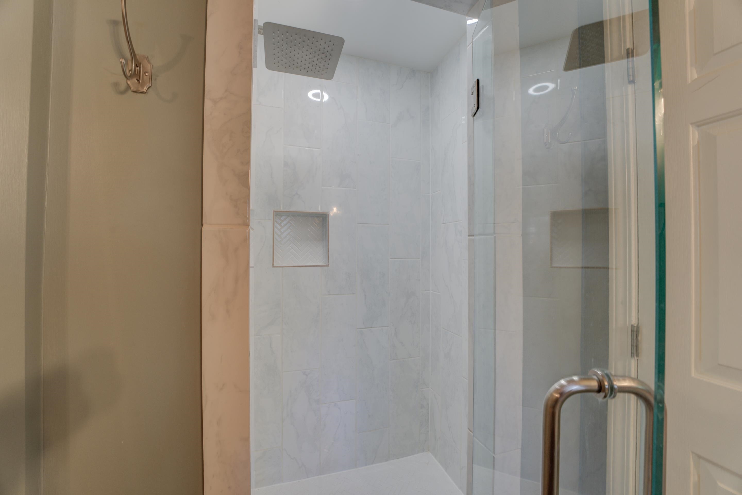 1515 Wolf Pack Drive Collierville, TN 38017 - Photo 24 of 28 a bathroom with a glass shower door