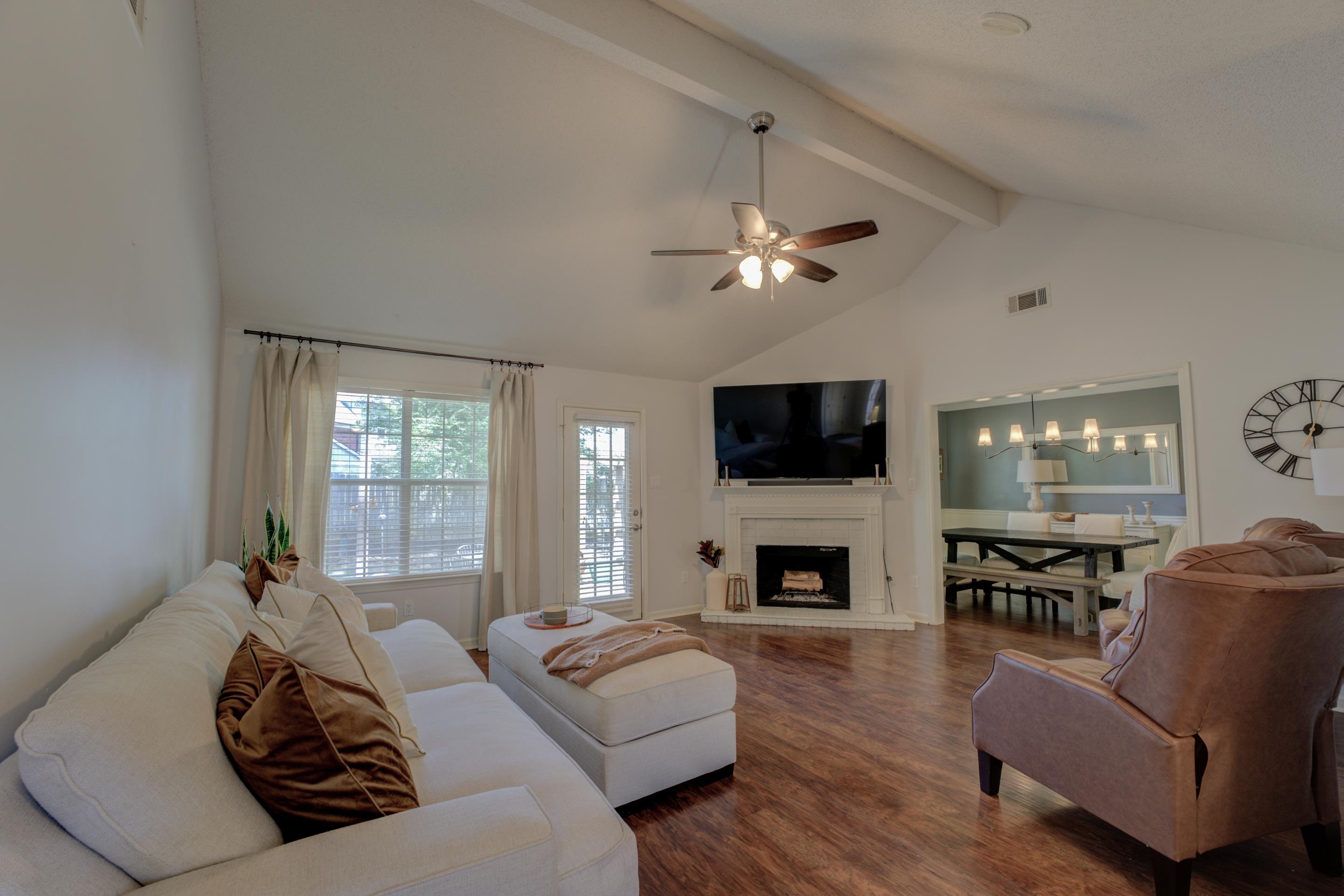 1515 Wolf Pack Drive Collierville, TN 38017 - Photo 4 of 28 a living room with furniture a fireplace and a flat screen tv