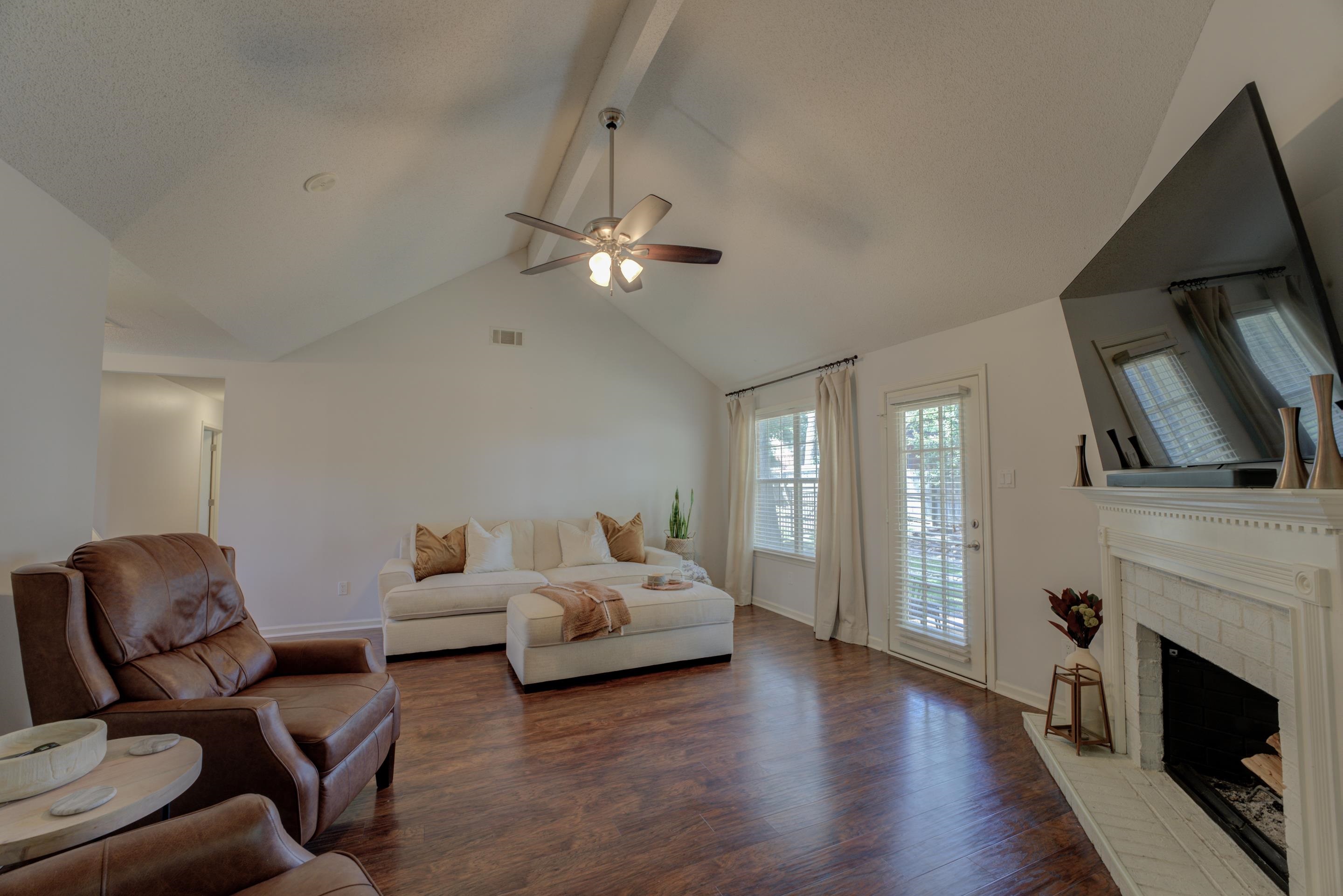 1515 Wolf Pack Drive Collierville, TN 38017 - Photo 5 of 28 a living room with furniture a fireplace and a flat screen tv