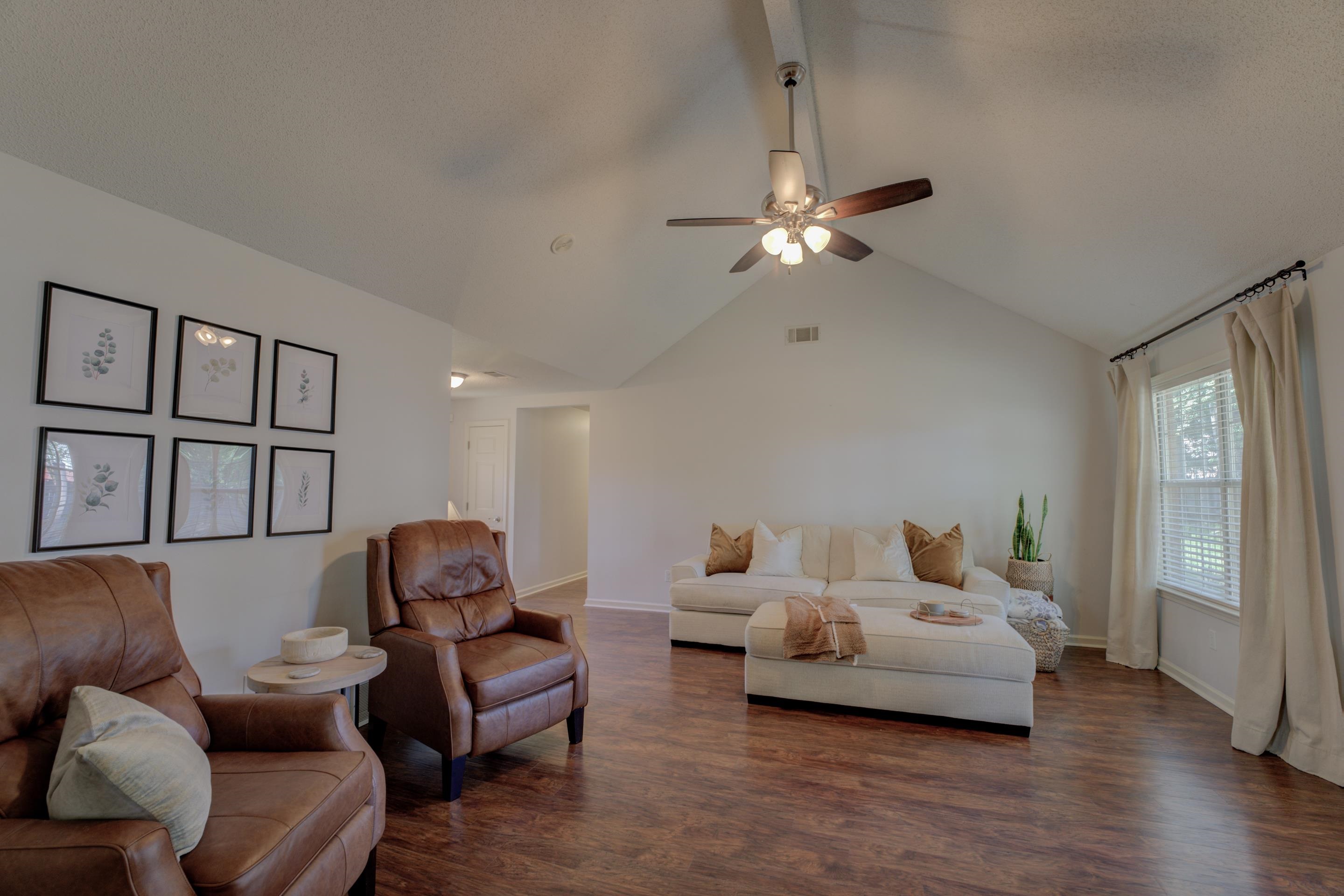 1515 Wolf Pack Drive Collierville, TN 38017 - Photo 6 of 28 a bedroom with furniture and a chandelier