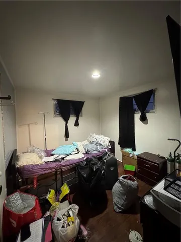 a room with furniture a rug and a closet