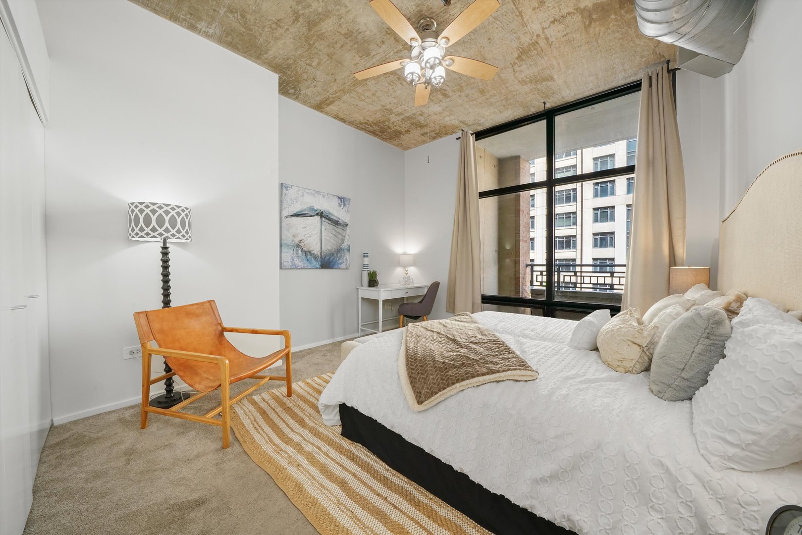 520 South State Street, Unit 503 Chicago, IL 60605 - Photo 13 of 25 a bedroom with a bed and a chandelier