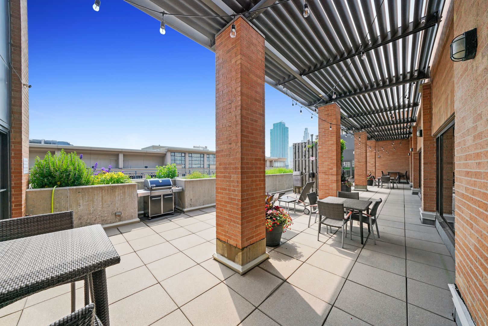 520 South State Street, Unit 503 Chicago, IL 60605 - Photo 22 of 25 a building outdoor space with patio furniture and a potted plant