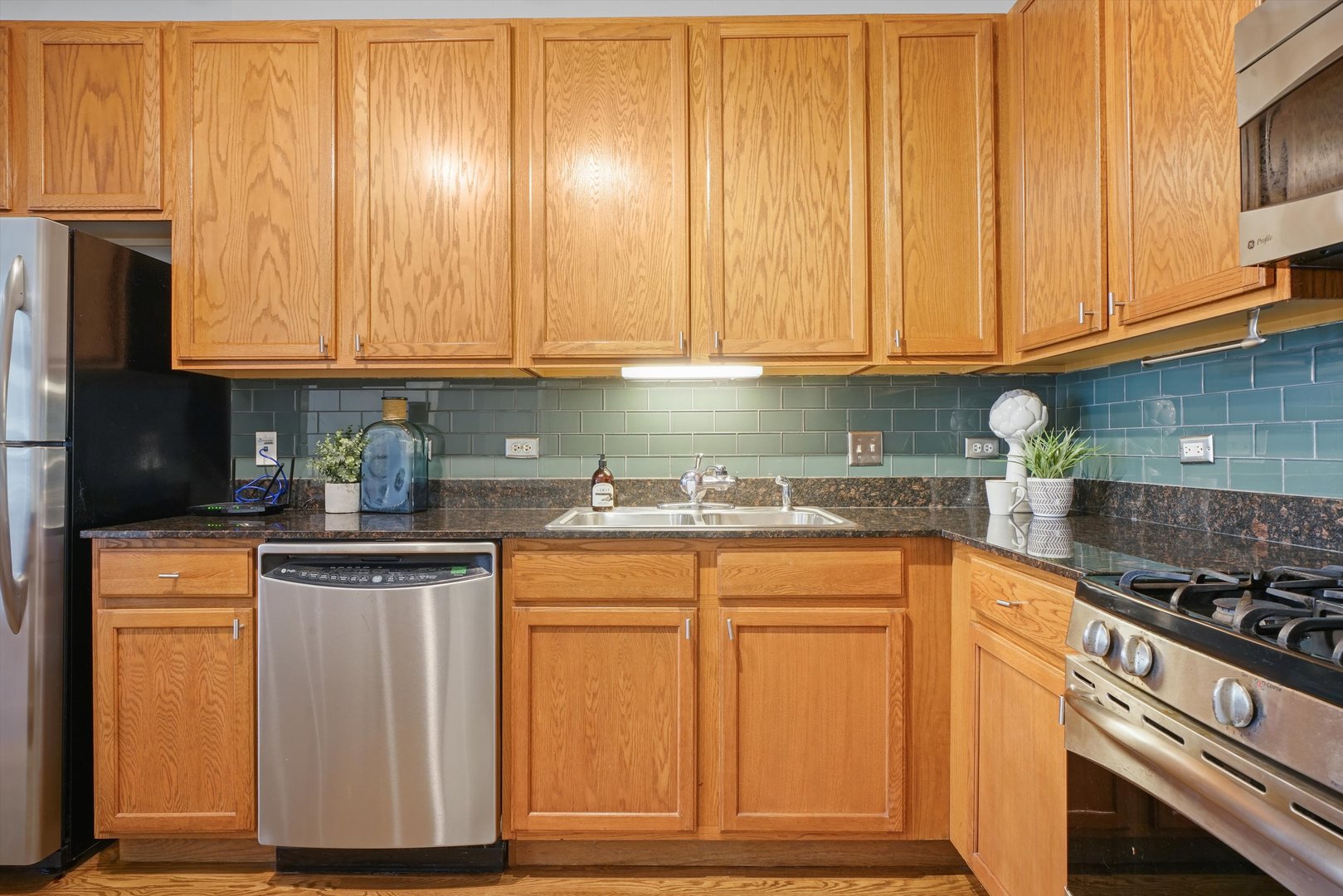 520 South State Street, Unit 503 Chicago, IL 60605 - Photo 9 of 25 a kitchen with granite countertop cabinets stainless steel appliances and a sink