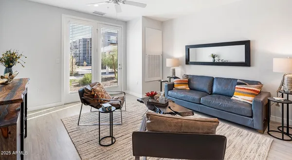 a living room with furniture and a window