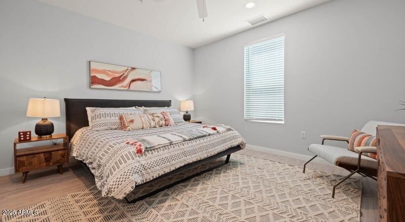6025 West Thomas Road, Unit 1 Phoenix, AZ 85033 - Photo 7 of 26 a bedroom with a bed and a window