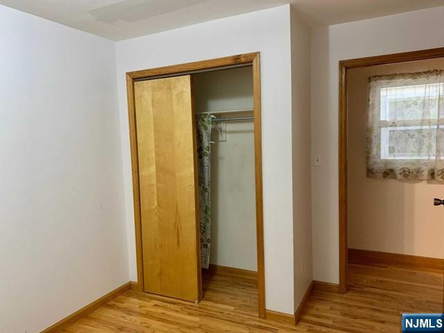 422 A Warren Street, Unit 1F Harrison, NJ 07029 - Photo 5 of 11 a view of front door with wooden floor