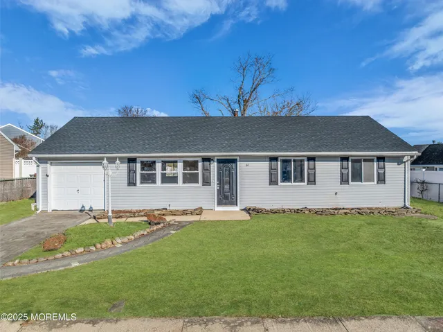 a house that has a big yard in front of it